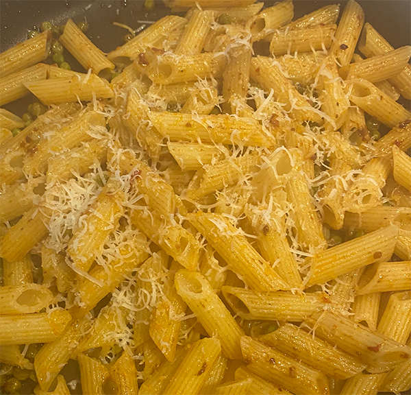 Pasta nduja, peas and Pecorino Romano